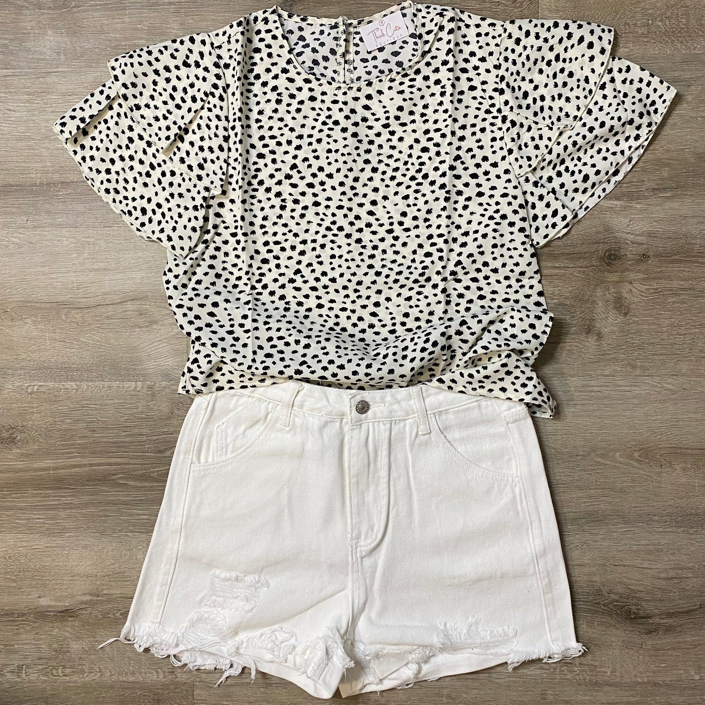 Enjoy a brunch date in this lightweight and flowy boho all over dalmatian print blouse. Comfortable, with gentle polyester fabric, that bring a regular length, and regular non-stretch fit. You will bring fashion and style with your sleeves of a Ruffle. This Blouse is a summer must have!  Pair this blouse with our distressed white jean shorts and you are ready for that date! 