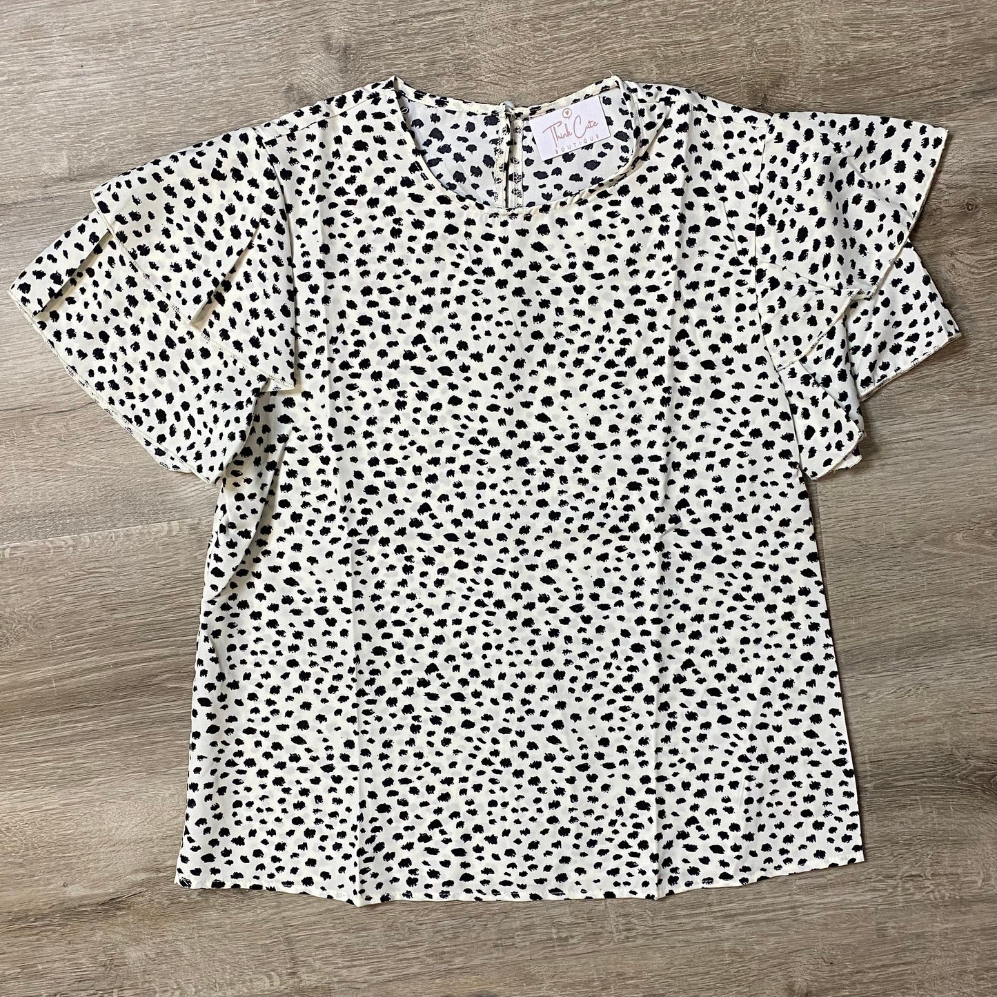 Enjoy a brunch date in this lightweight and flowy boho all over dalmatian print blouse. Comfortable, with gentle polyester fabric, that bring a regular length, and regular non-stretch fit. You will bring fashion and style with your sleeves of a Ruffle. This Blouse is a summer must have! Pair this blouse with our distressed white jean shorts and you are ready for that date!